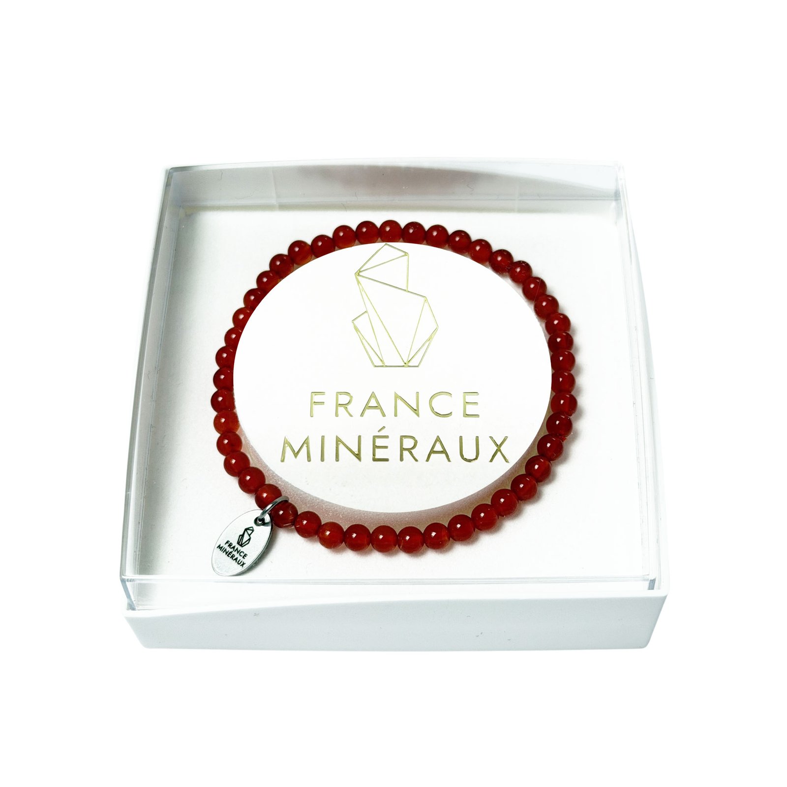 A bracelet of small polished orange carnelian beads on a wrist