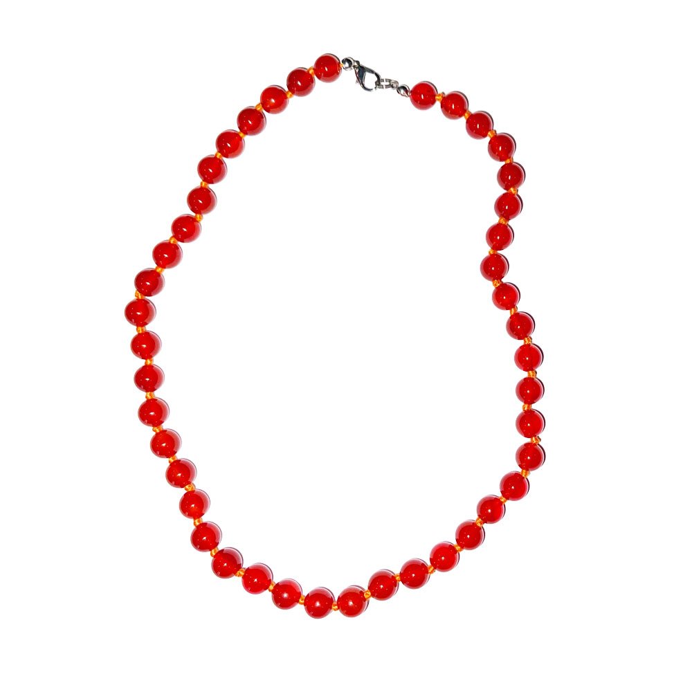 A knotted necklace of polished orange carnelian beads