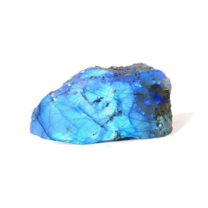 A grey labradorite stone flashing iridescent blue and green