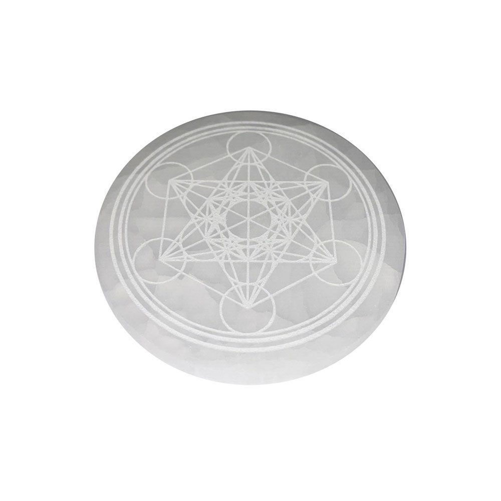 An engraved selenite charging plate with a Metatron's Cube design