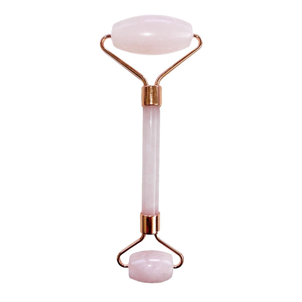 A rose quartz facial roller for a skincare ritual