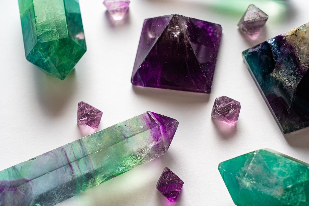 A green and purple fluorite crystal with colour zoning