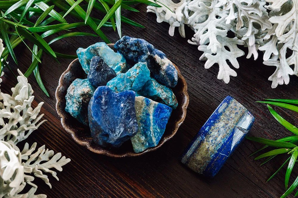 A polished lapis lazuli stone, deep blue with golden pyrite flecks