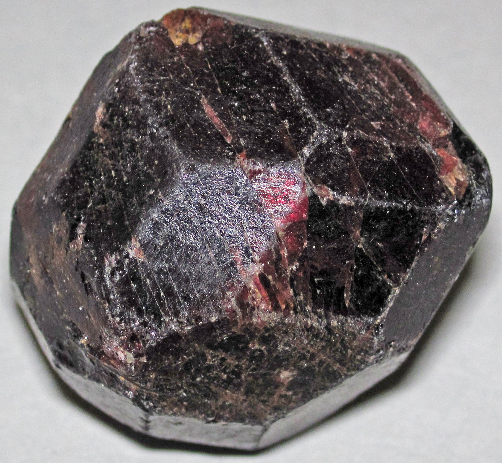Deep red almandine garnet crystal