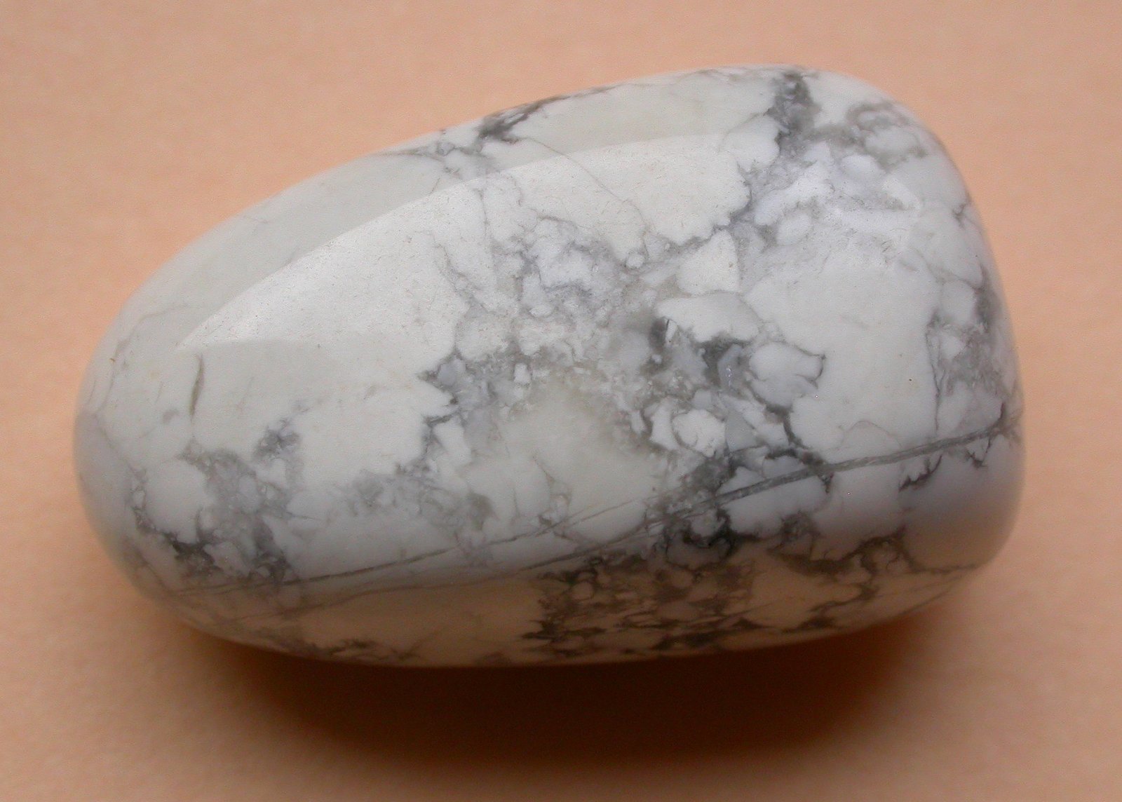 Tumbled white howlite with grey web-like veins