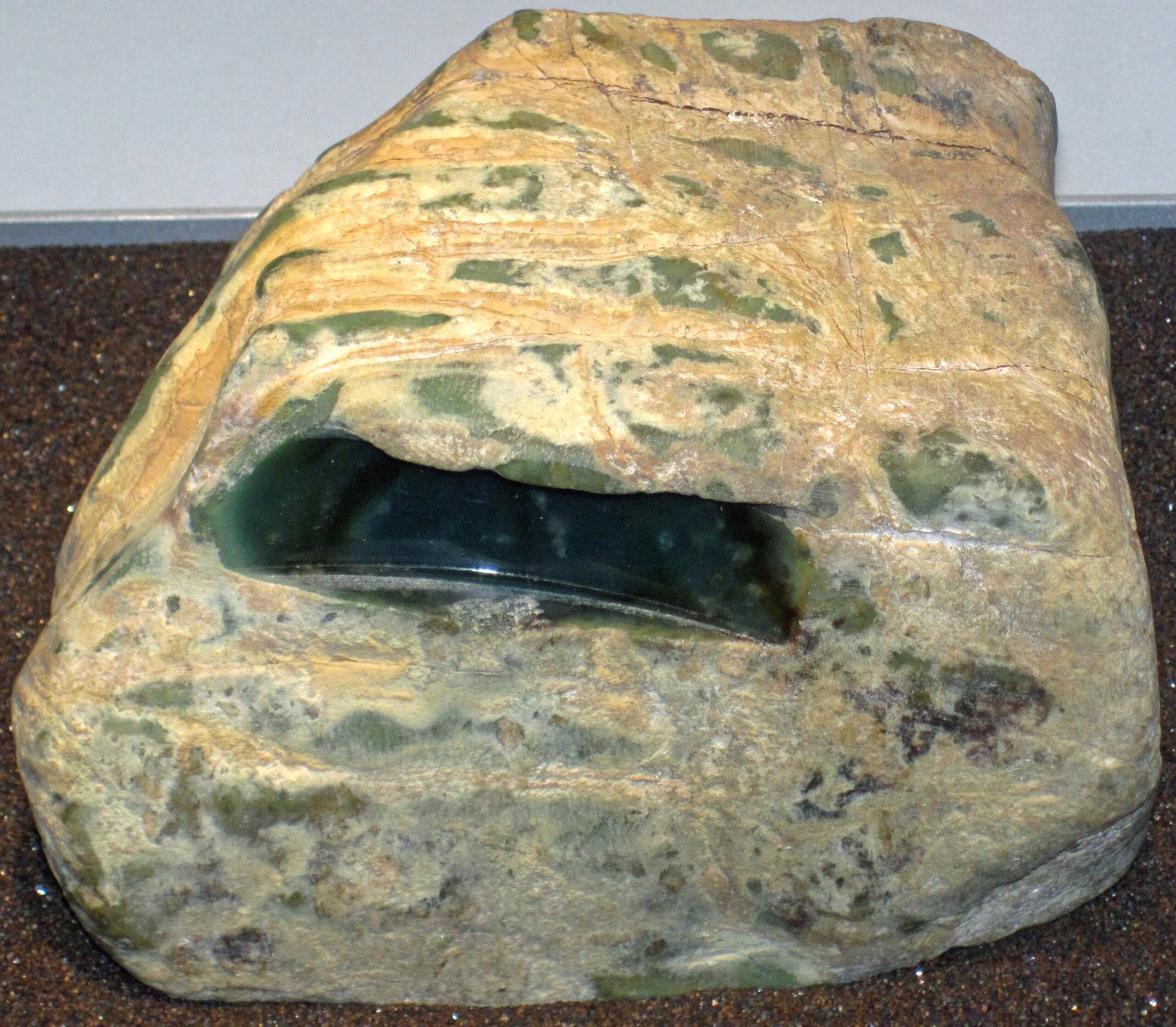 Green jadeite jade boulder with pale weathering rind, from Burma (Myanmar)