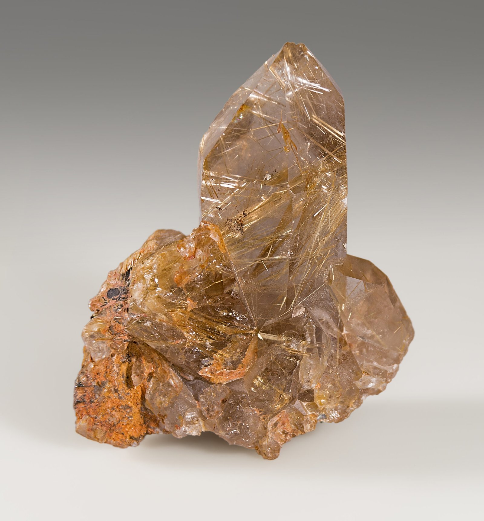 Clear quartz with golden rutile needle inclusions