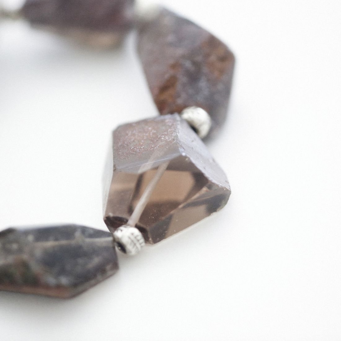 A warm orange sunstone with metallic aventurescent shimmer