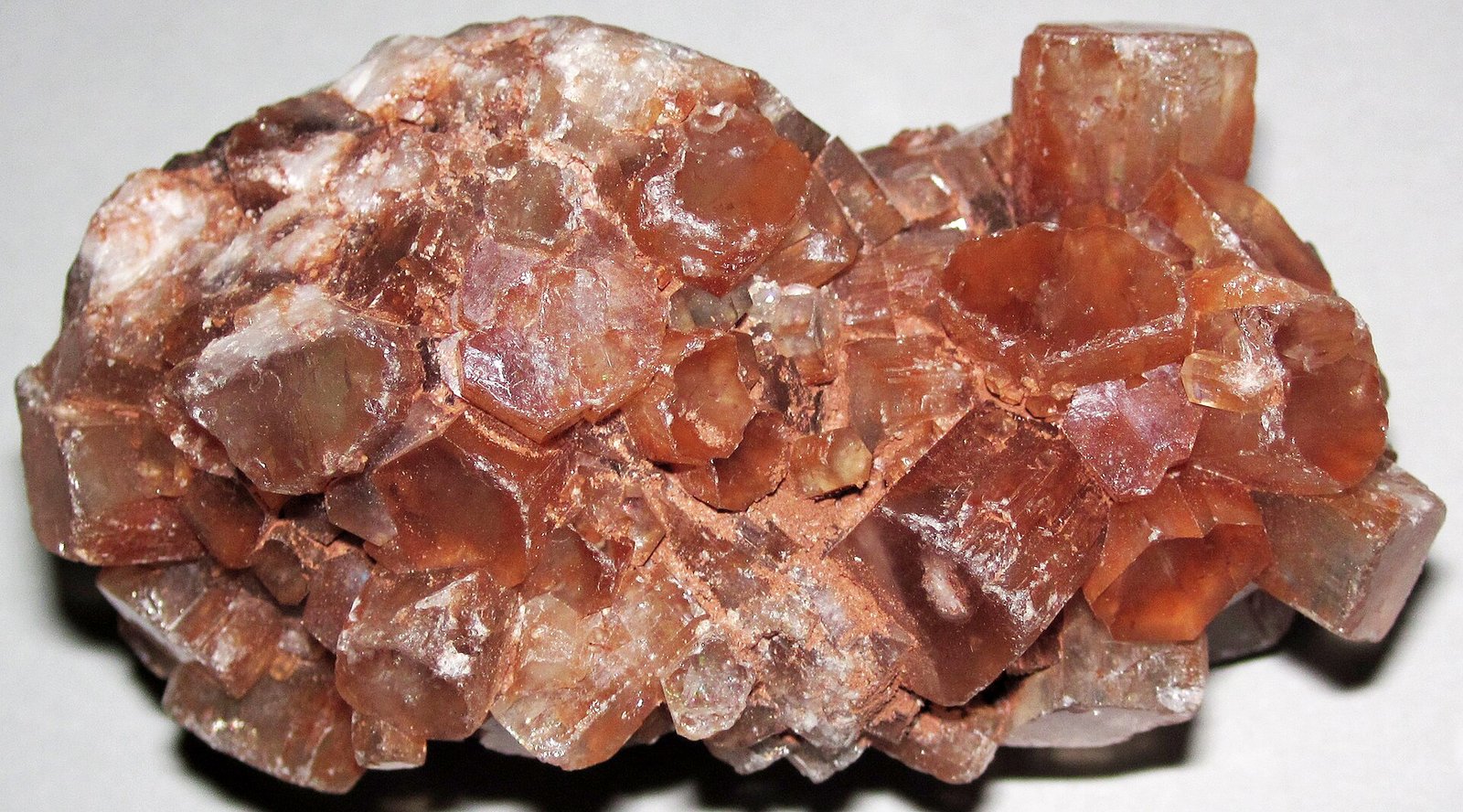 Reddish-brown aragonite sputnik cluster of radiating crystals from Morocco