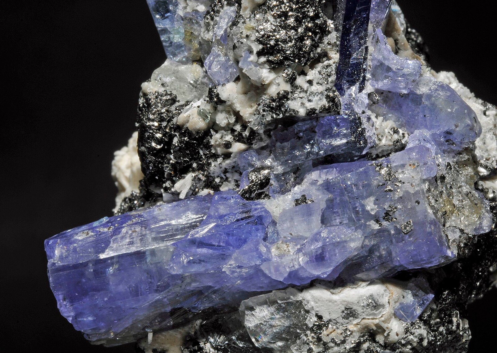 Blue-violet tanzanite crystal, the gem variety of zoisite, on matrix