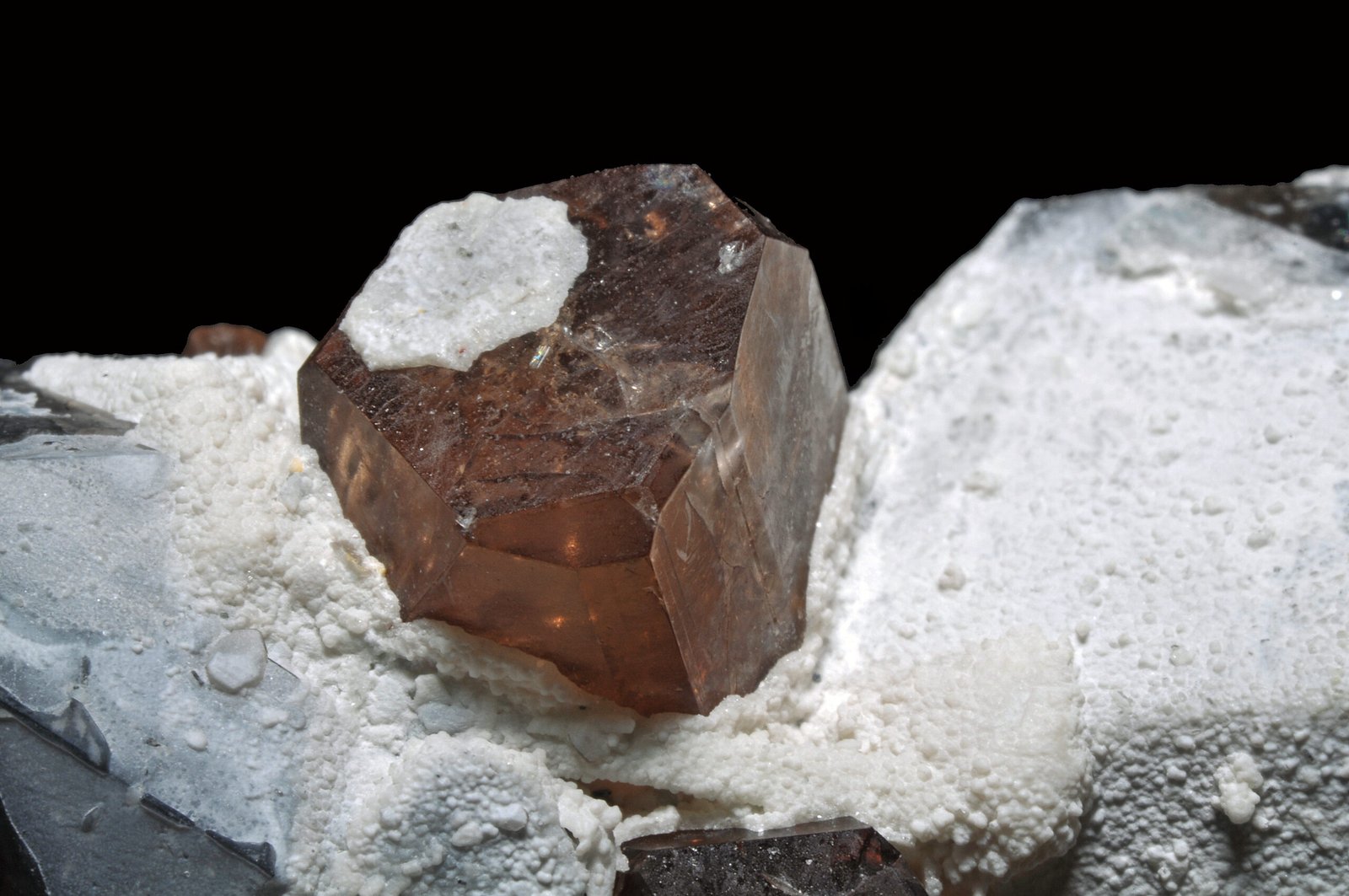 A colourless topaz crystal on smoky quartz from Skardu, Pakistan
